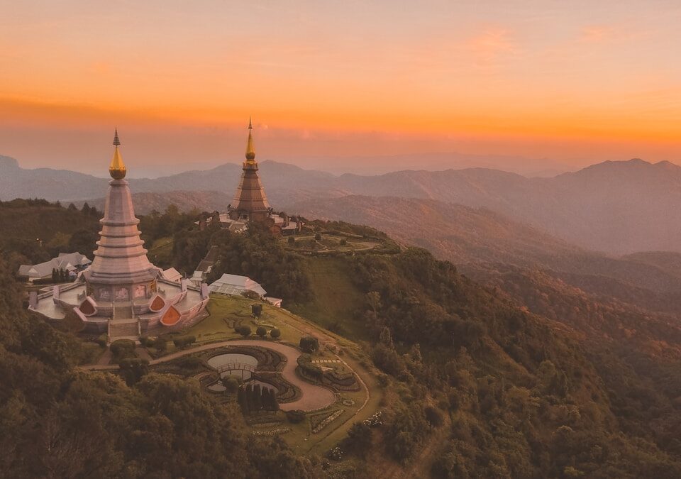 bird's-eye view of white temple surround by trees