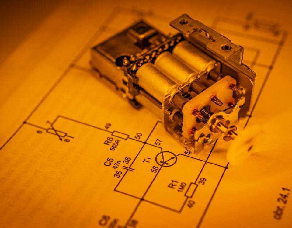 an electrical device laying on top of a blueprint