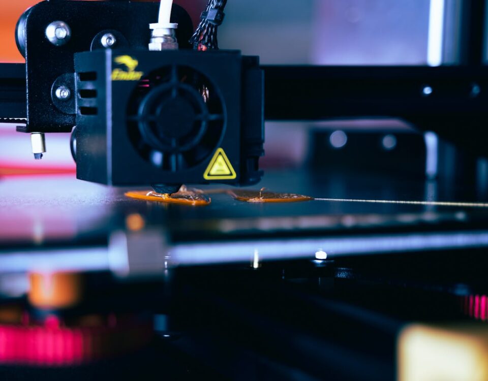 Detailed view of a 3D printer head during operation, showcasing modern printing technology.